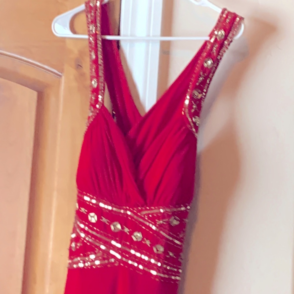 Full length (slight train) red backless prom dress. Stretch form fitting fabric.